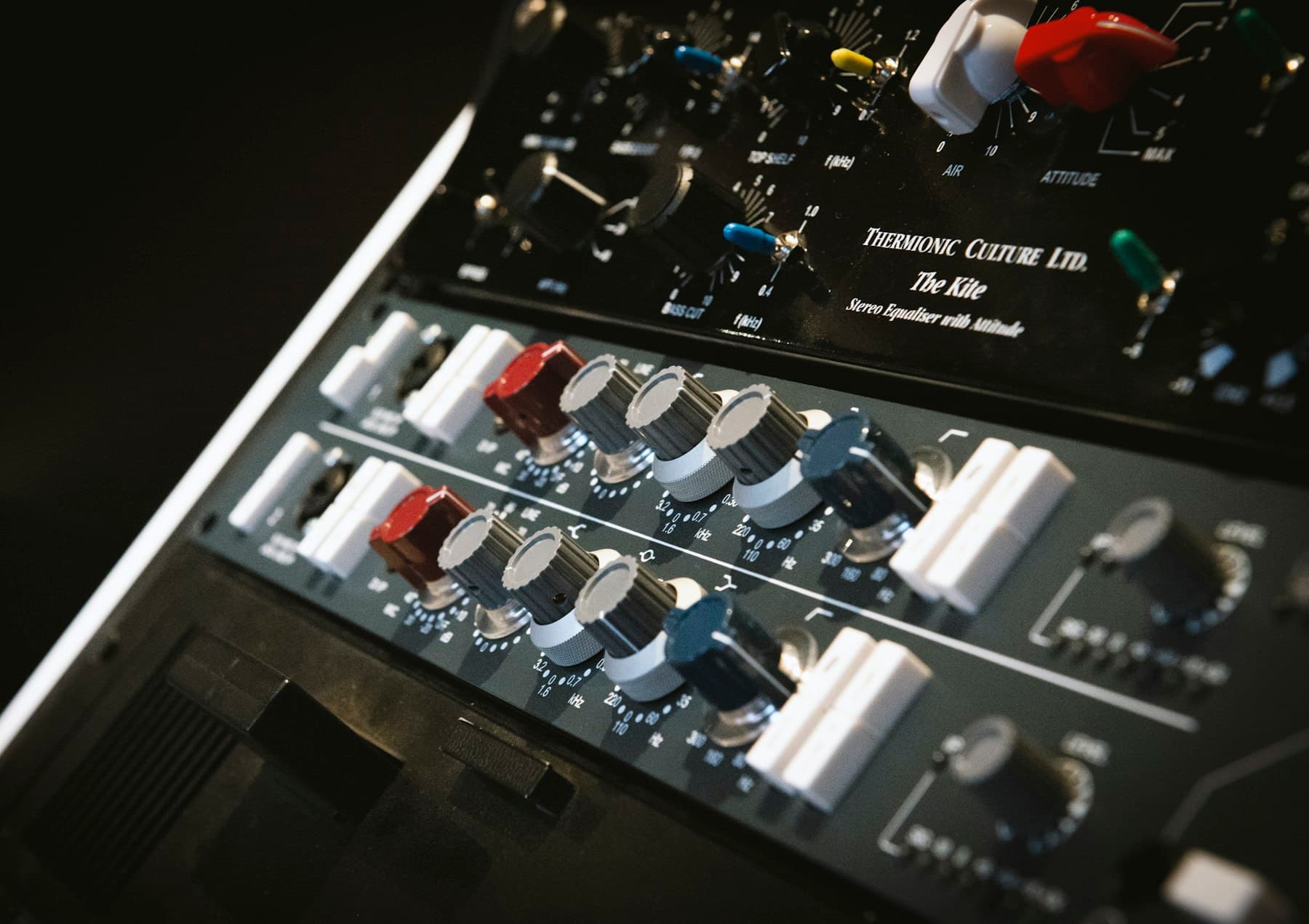 Black and white audio mixer with tuning dials
