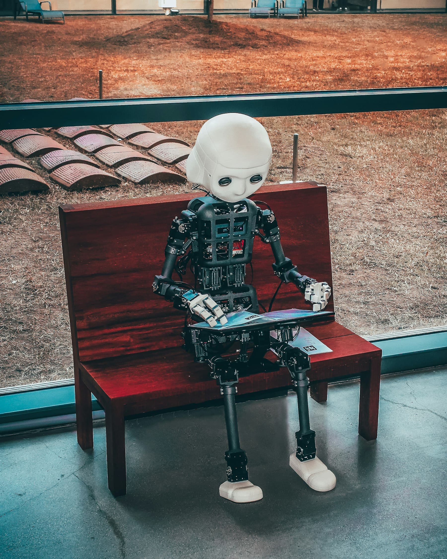 Black and white robot toy representing an AI agent